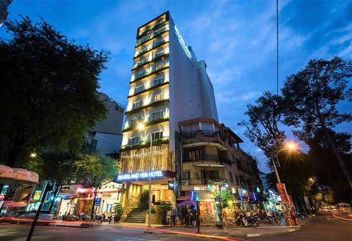 Silverland Yen Hotel exterior at night. Gay-friendly hotel in Ho Chi Minh City with illuminated facade. Street view of the hotel.