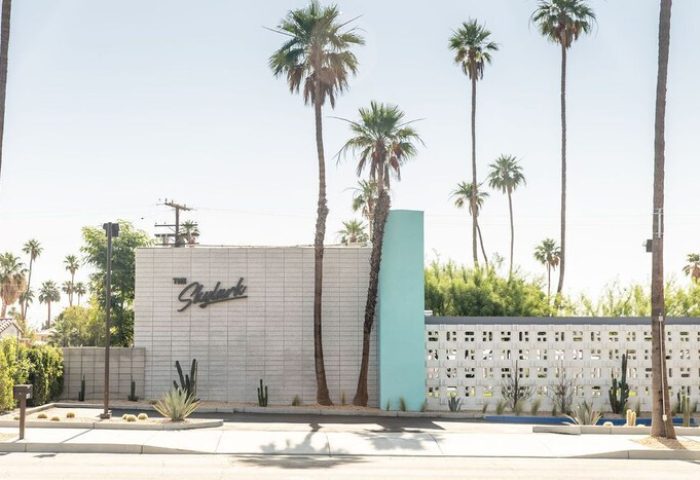 Skylark Hotel, a gay-friendly hotel. Exterior view of the Skylark Hotel with palm trees. A welcoming destination for gay travelers.
