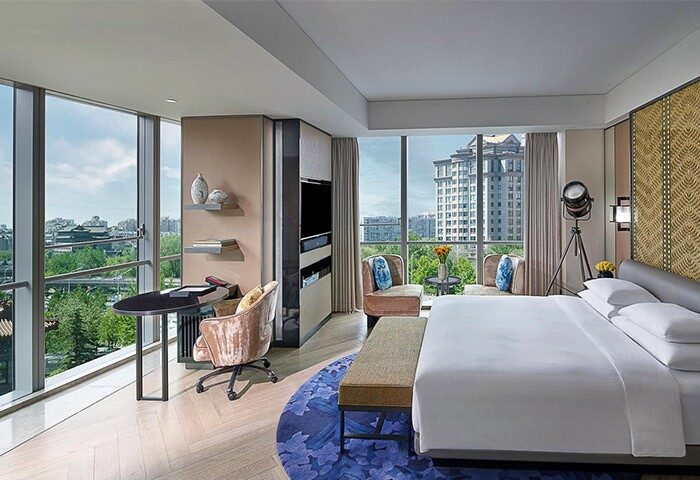 Gay-friendly Sofitel Beijing Central hotel room. Modern design, city view, desk, bed, and seating area. Upscale accommodations in Beijing.