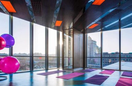 Gym at Sofitel Beijing Central, a gay-friendly hotel. Exercise mats and fitness balls with a Beijing city view. A great place to workout.