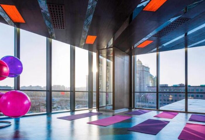 Gym at Sofitel Beijing Central, a gay-friendly hotel. Exercise mats and fitness balls with a Beijing city view. A great place to workout.
