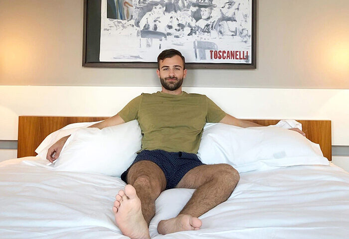 Gay-Friendly Hotel Sofitel Berlin Kurfurstendamm: Man relaxing on a bed. Pet-friendly hotel. Dorint Kurfurstendamm Hotel for gay travel.