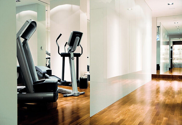 Dorint Kurfurstendamm Hotel gym. Treadmill and elliptical machine in a bright, modern fitness center. Gay-friendly hotel in Berlin.