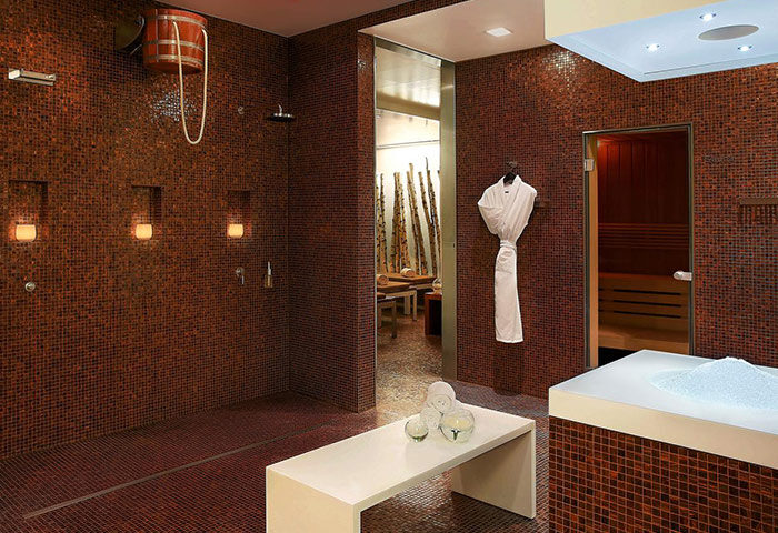 Dorint Kurfurstendamm Hotel's spa area. Sauna, shower, and relaxation zone. Gay-friendly hotel in Berlin. Pet-friendly option.