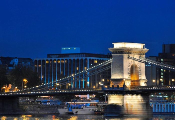 Sofitel Budapest Hotel view at night with the Chain Bridge. Gay-friendly, pet-friendly hotel for gay men travelers in Budapest, Hungary.