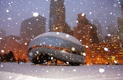 Chicago's The Bean in winter snow near Sofitel Chicago Magnificent Mile. Gay-friendly hotel near iconic landmark.