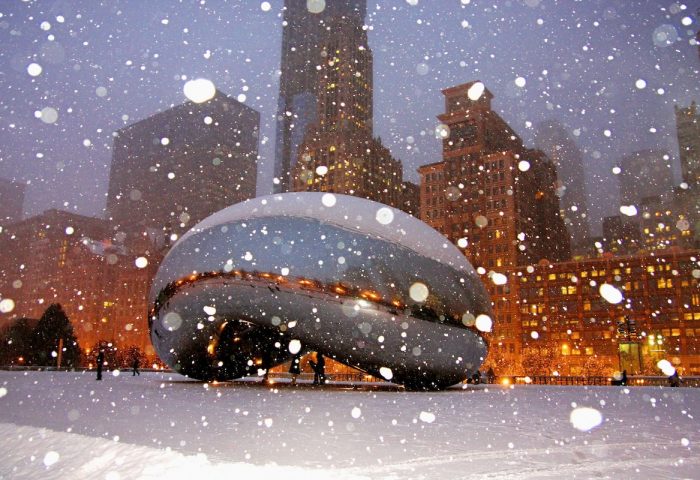 Chicago's The Bean in winter snow near Sofitel Chicago Magnificent Mile. Gay-friendly hotel near iconic landmark.