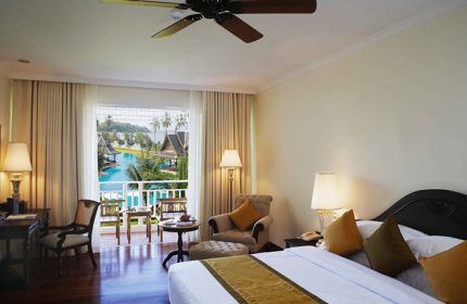 Sofitel Krabi Phokeethra Golf and Spa Resort room. Balcony view of pool. Gay-friendly hotel for gay men's travel advice in Krabi, Thailand.