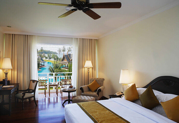 Sofitel Krabi Phokeethra Golf and Spa Resort room. Balcony view of pool. Gay-friendly hotel for gay men's travel advice in Krabi, Thailand.