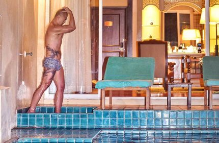 Gay-friendly Sofitel Krabi Phokeethra Golf and Spa Resort pool access. Man with tattoos. Luxury travel for gay men in Thailand.