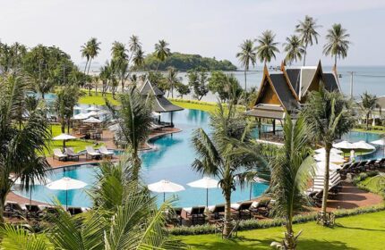 Sofitel Krabi Phokeethra Golf and Spa Resort's pool. Gay-friendly hotel with palm trees, Thai pavilions, sunbeds and ocean view.