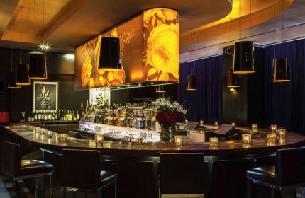 Sofitel Los Angeles at Beverly Hills Hotel's bar. This gay-friendly hotel offers a stylish bar area with unique lighting & seating.