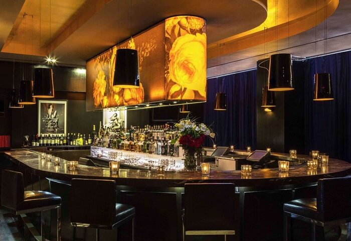 Sofitel Los Angeles at Beverly Hills Hotel's bar. This gay-friendly hotel offers a stylish bar area with unique lighting & seating.