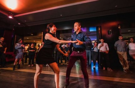 Dancing at Sofitel Los Angeles at Beverly Hills Hotel. Gay-friendly hotel nightlife for men. Couple dancing in a club.