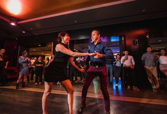 Dancing at Sofitel Los Angeles at Beverly Hills Hotel. Gay-friendly hotel nightlife for men. Couple dancing in a club.