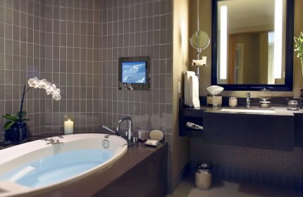 Sofitel Los Angeles at Beverly Hills Hotel bathroom. Gay-friendly hotel with tub, TV, and modern design. Upscale travel for gay men.