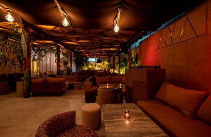 Sofitel Los Angeles at Beverly Hills Hotel's AYA Restaurant. Gay-friendly hotel with stylish seating, warm lighting, and exotic decor.