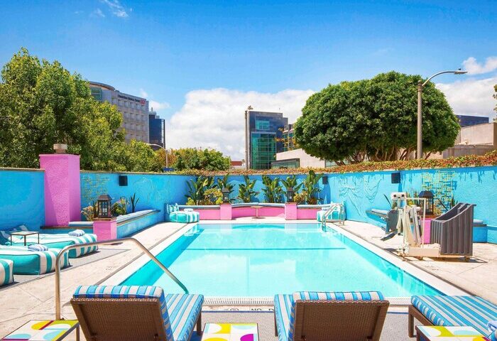 Sofitel Los Angeles at Beverly Hills Hotel pool. Gay-friendly hotel with colorful design, perfect for gay men travel. #gaytravel