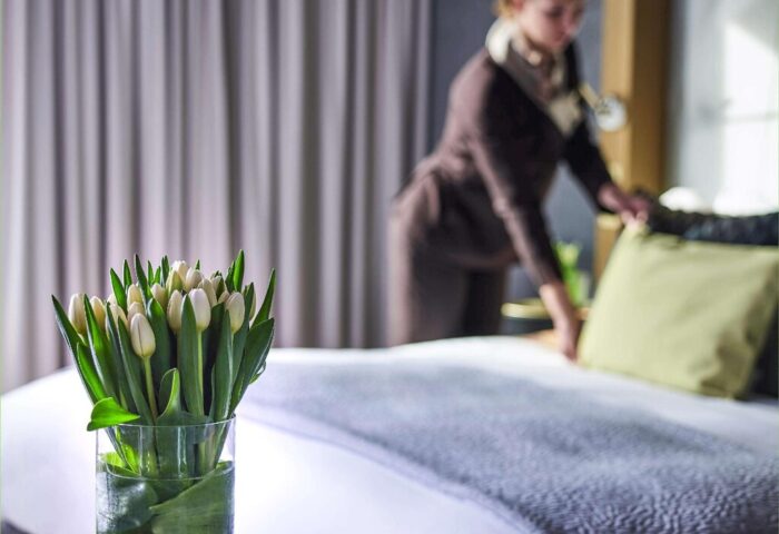 Sofitel Munich Bayerpost Hotel room with tulips. Gay-friendly hotel offering luxury accommodations in Munich for gay travelers.