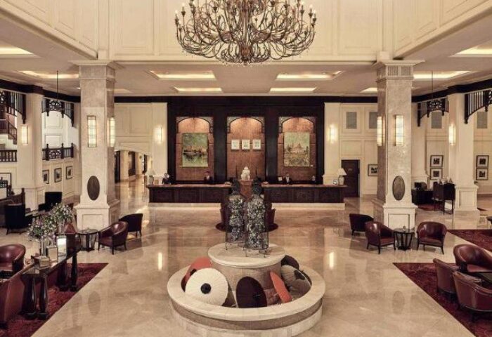 Sofitel Phnom Penh Phokeethra Hotel's grand lobby. This gay-friendly hotel boasts luxurious interiors and a welcoming atmosphere. Ideal for gay travel.