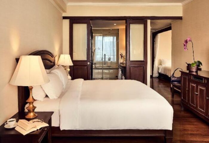 Sofitel Phnom Penh Phokeethra Hotel room. Gay-friendly hotel with bedroom, bathroom, and living area. Luxury travel in Phnom Penh.