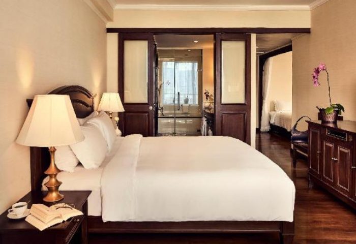 Sofitel Phnom Penh Phokeethra Hotel room. Gay-friendly hotel with bedroom, bathroom, and living area. Luxury travel in Phnom Penh.