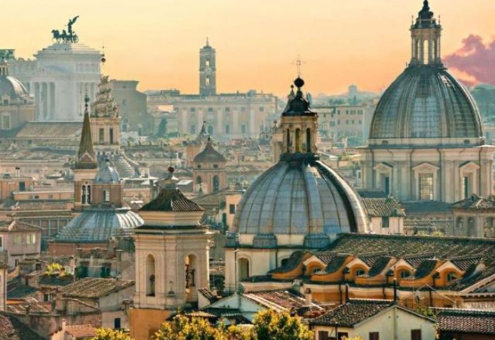 Rome skyline view from Sofitel Rome Villa Borghese Hotel. Gay-friendly hotel with domes, towers, and historic buildings. Travel.