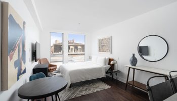 Sonder Gare Saint Denis gay-friendly hotel room. Modern interior with bed, table, and art. A comfortable stay for gay travelers.