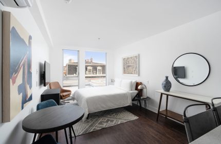 Sonder Gare Saint Denis gay-friendly hotel room. Modern interior with bed, table, and art. A comfortable stay for gay travelers.