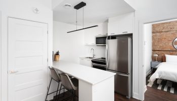 Sonder Gare Saint Denis gay-friendly hotel room. Modern kitchen & bedroom. Perfect for LGBTQ+ travelers seeking style & comfort in Paris.