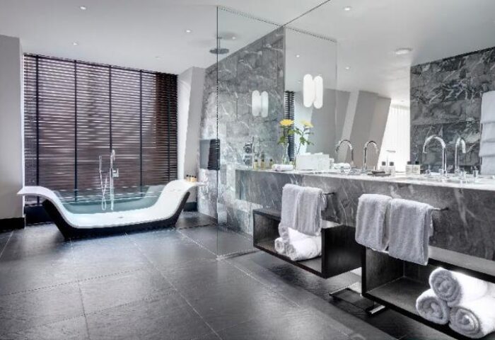 South Place Hotel's pet-friendly bathroom. This gay-friendly hotel features a modern tub, marble accents, & sleek design. Perfect for gay travel.