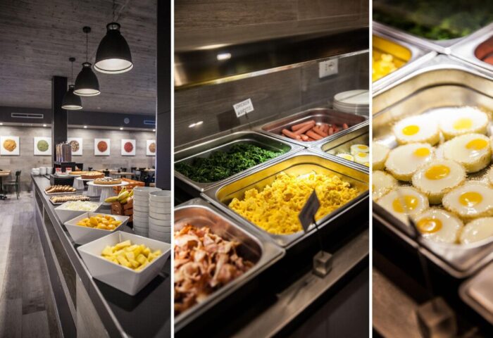 Breakfast buffet at Spice Hotel Milano, a gay-friendly hotel. Features continental options: eggs, bacon, sausages, spinach, fruit, pastries, and hot dishes.