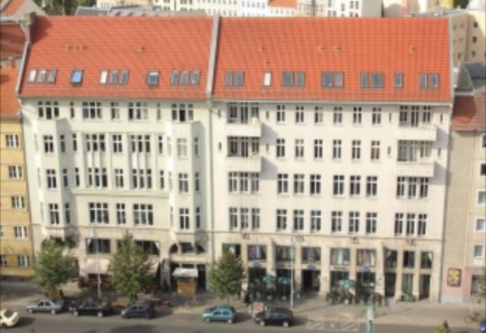St. Christopher's gay-friendly Hostel Berlin. Building exterior with red roof. A popular choice for gay travelers in Berlin.