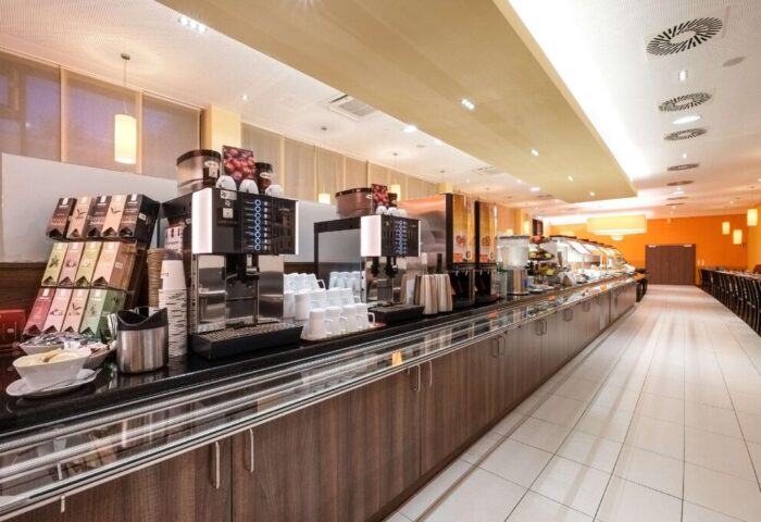 Breakfast buffet at Star Inn Hotel Wien Schönbrunn, a gay-friendly hotel. Coffee, tea, and food options are available for guests.