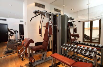 Starhotels Ritz gym. Weights, machines, and cardio equipment in a well-lit space. A gay-friendly hotel with fitness facilities.