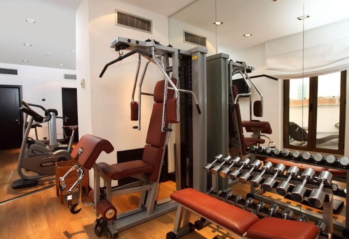 Starhotels Ritz gym. Weights, machines, and cardio equipment in a well-lit space. A gay-friendly hotel with fitness facilities.
