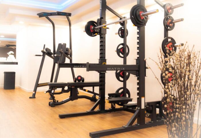 Steigenberger Hotel Koln's gym. Gay-friendly hotel features weightlifting equipment, a bench, and a pull-up bar for a complete workout.