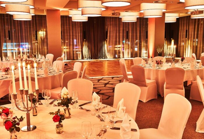 Event space at the gay-friendly Steigenberger Hotel Köln, Germany. Tables set for a wedding or party. Ideal for gay travelers.