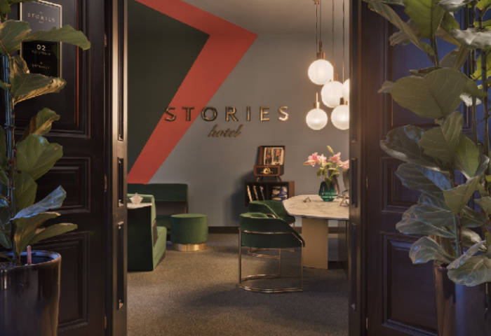 Stories Hotel Budapest lobby view. Gay-friendly hotel interior with modern design, plants, and stylish furniture.