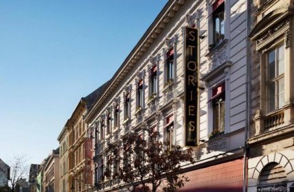 Stories Hotel Budapest exterior. Gay-friendly hotel with a vertical Stories Hotel sign. A great choice for gay travelers in Budapest.