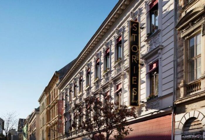 Stories Hotel Budapest exterior. Gay-friendly hotel with a vertical Stories Hotel sign. A great choice for gay travelers in Budapest.