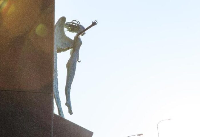 Suz Hotel's gay-friendly vibe: A statue of a winged figure reaching skyward, symbolizing freedom and acceptance. A welcoming image for LGBT travelers.