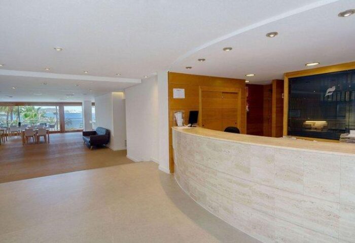 THB Los Molinos Adults Only gay-friendly hotel reception area. Modern design with a view to the sea. Perfect for gay men's travel.
