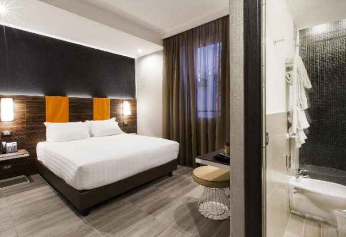 Gay-friendly hotel room at The Republic. Modern design with double bed, bathroom with bidet, and stylish decor. Perfect for gay travel.