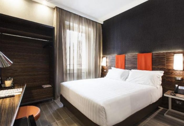 The Republic gay-friendly hotel room: bed, desk, and closet. Modern design, comfortable for gay travelers. Perfect for your next gay vacation.