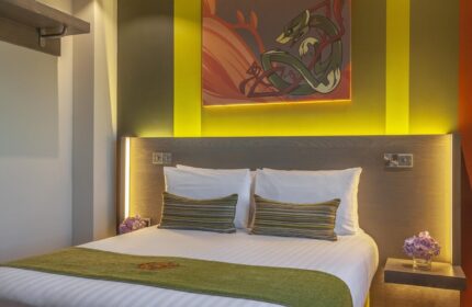 Temple Bar Inn gay-friendly hotel room. Modern design with a double bed, artwork, and ambient lighting. Gay travel in Dublin, Ireland.