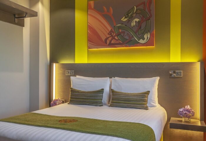 Temple Bar Inn gay-friendly hotel room. Modern design with a double bed, artwork, and ambient lighting. Gay travel in Dublin, Ireland.