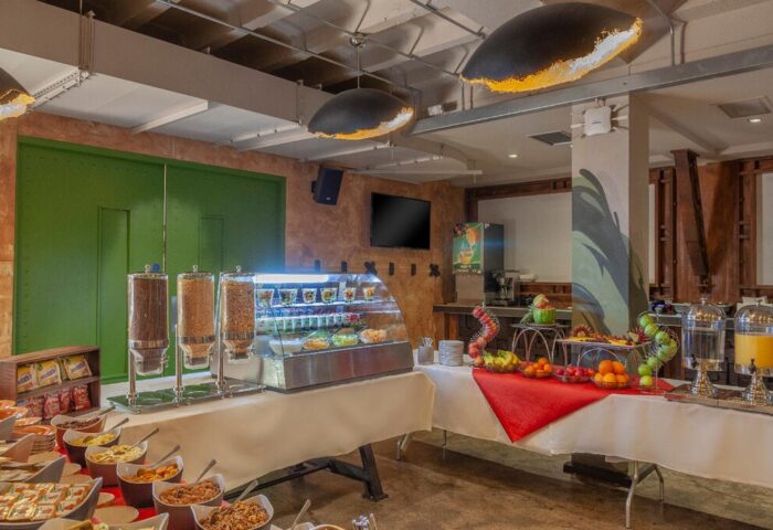 Breakfast buffet at Temple Bar Inn, a gay-friendly hotel. Cereal dispensers, pastries, fruit, and juice offer a variety of options.