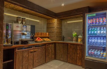 Temple Bar Inn's gay-friendly hotel refreshment station. Coffee machine, fruit, snacks, and a cooler with drinks available for guests.