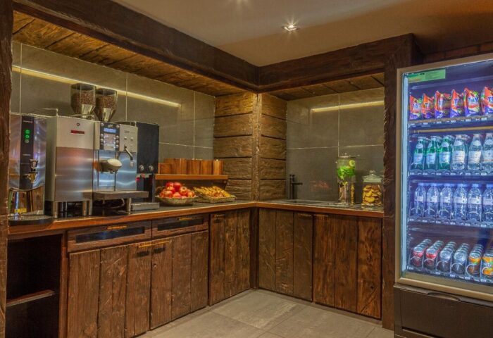 Temple Bar Inn's gay-friendly hotel refreshment station. Coffee machine, fruit, snacks, and a cooler with drinks available for guests.